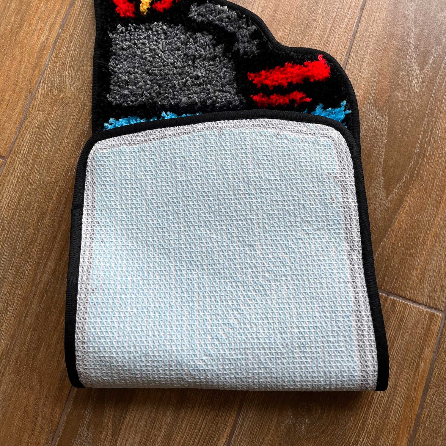 Tufted Rug Bic Lighter Rug Folded Showing Backing