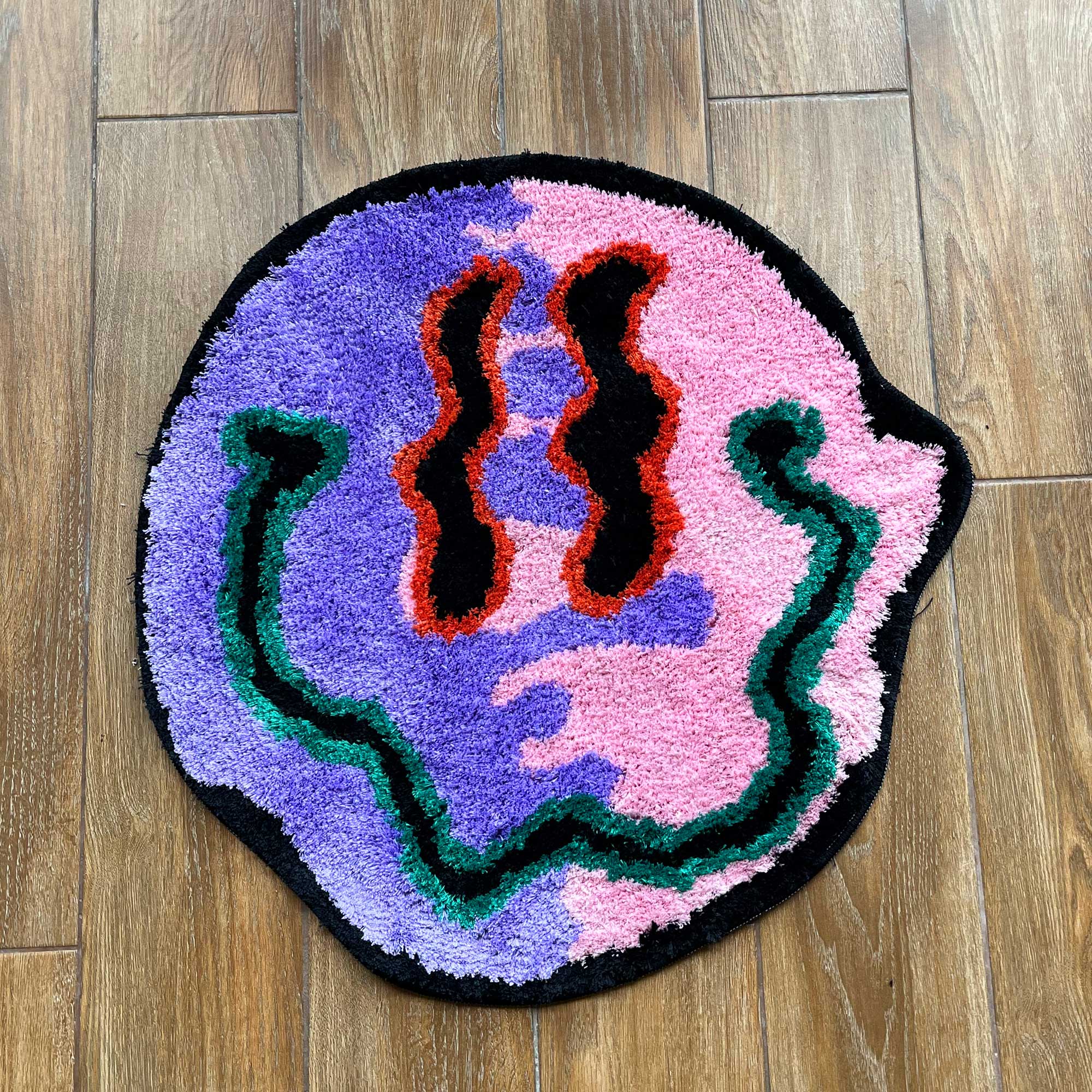 http://tuftedstudios.com/cdn/shop/files/Tufted-Trippy-Two-Face-Smiley-Face-Rug-Tufted-Studios-Tufted-Rug-1.jpg?v=1700365072