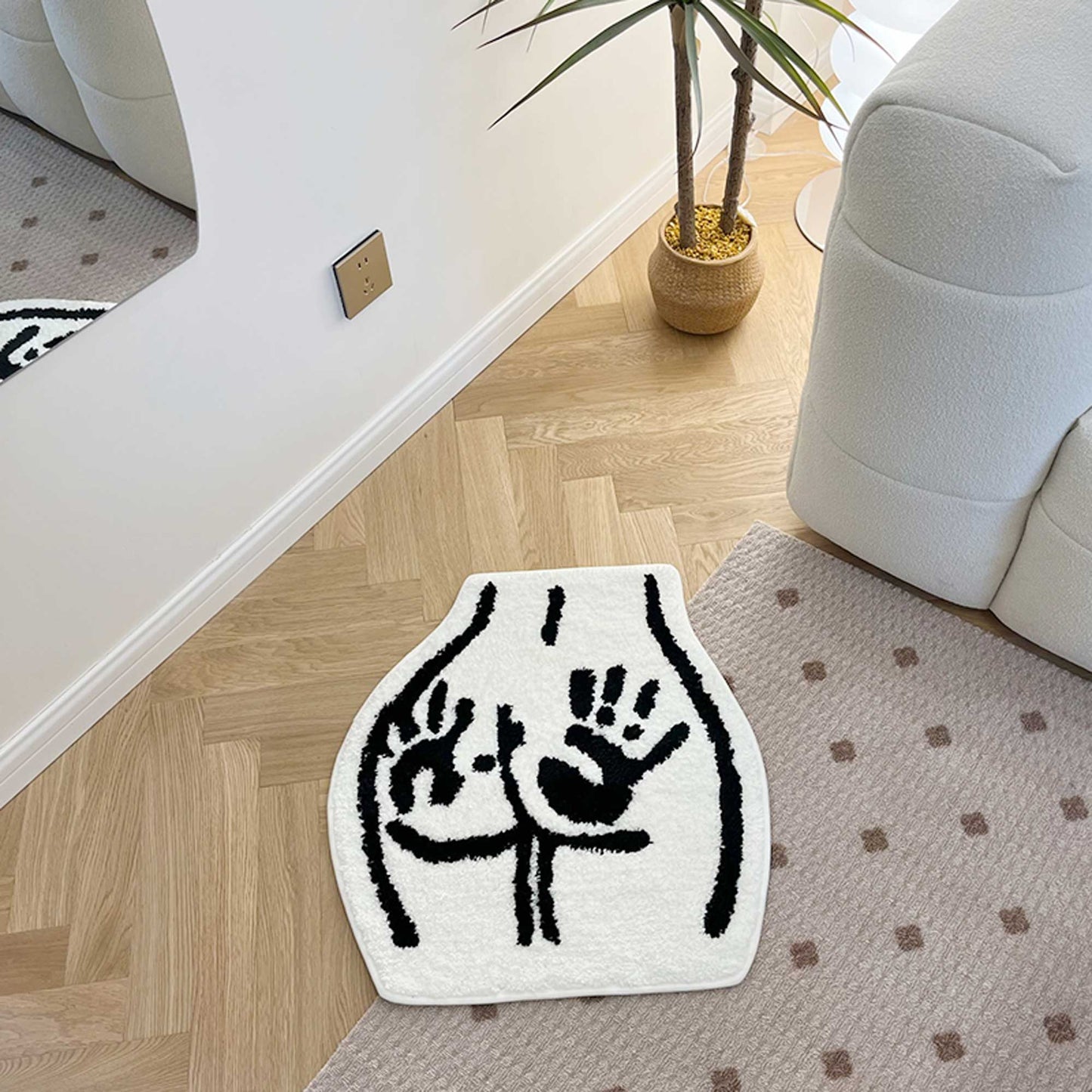 Tufted Rug Handprint on Booty Rug Front in a Living Room