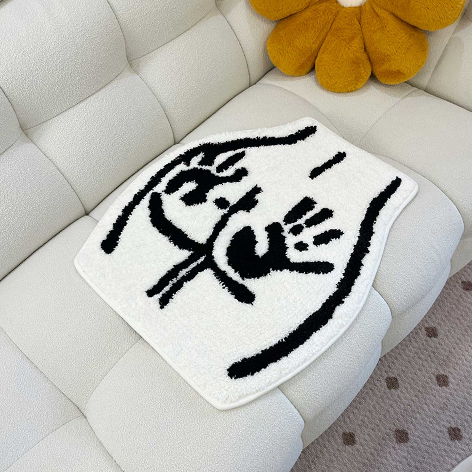Tufted Rug Handprint on Booty Rug Front on a Sofa